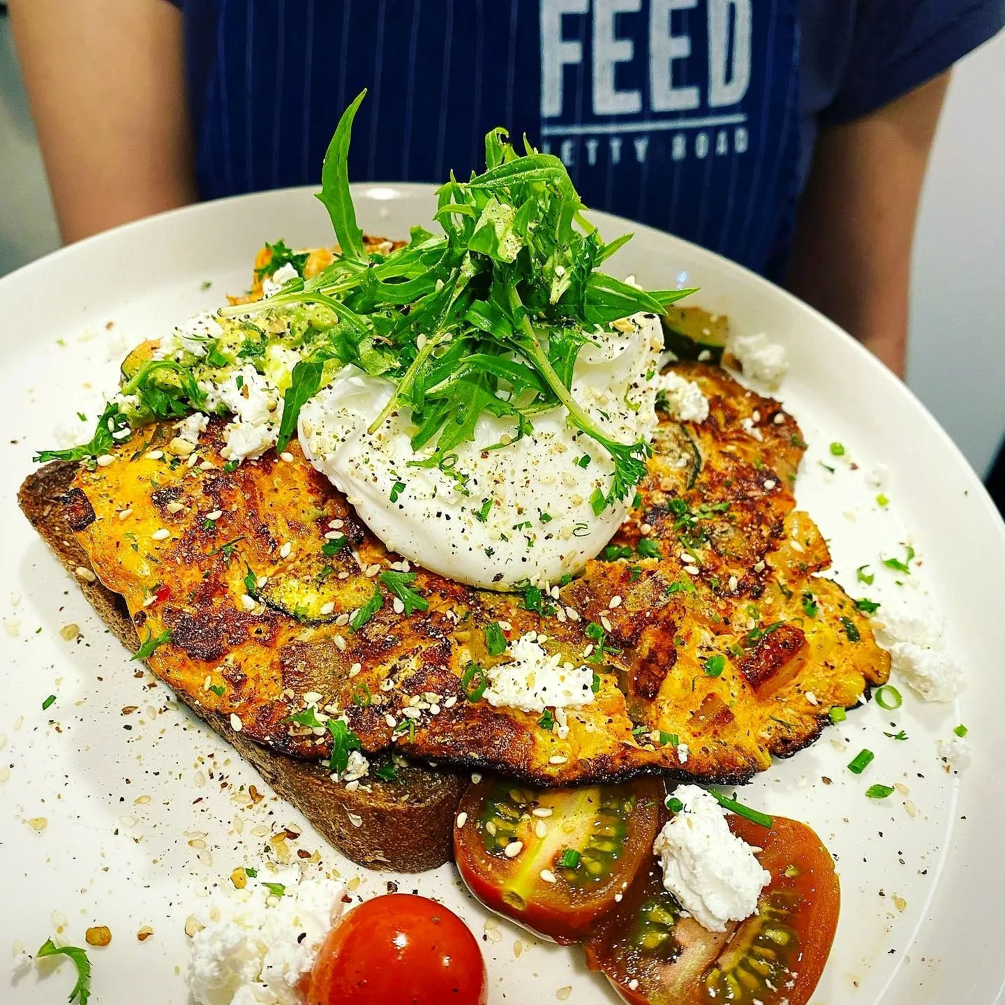 Big breakfast plate under the Feed sign