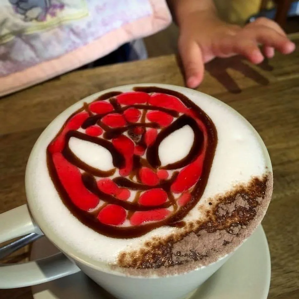 Spiderman drawn in chocolate on a kids drink